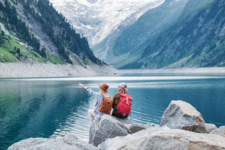 Travel image. Travelers team look on the mountain landscape.